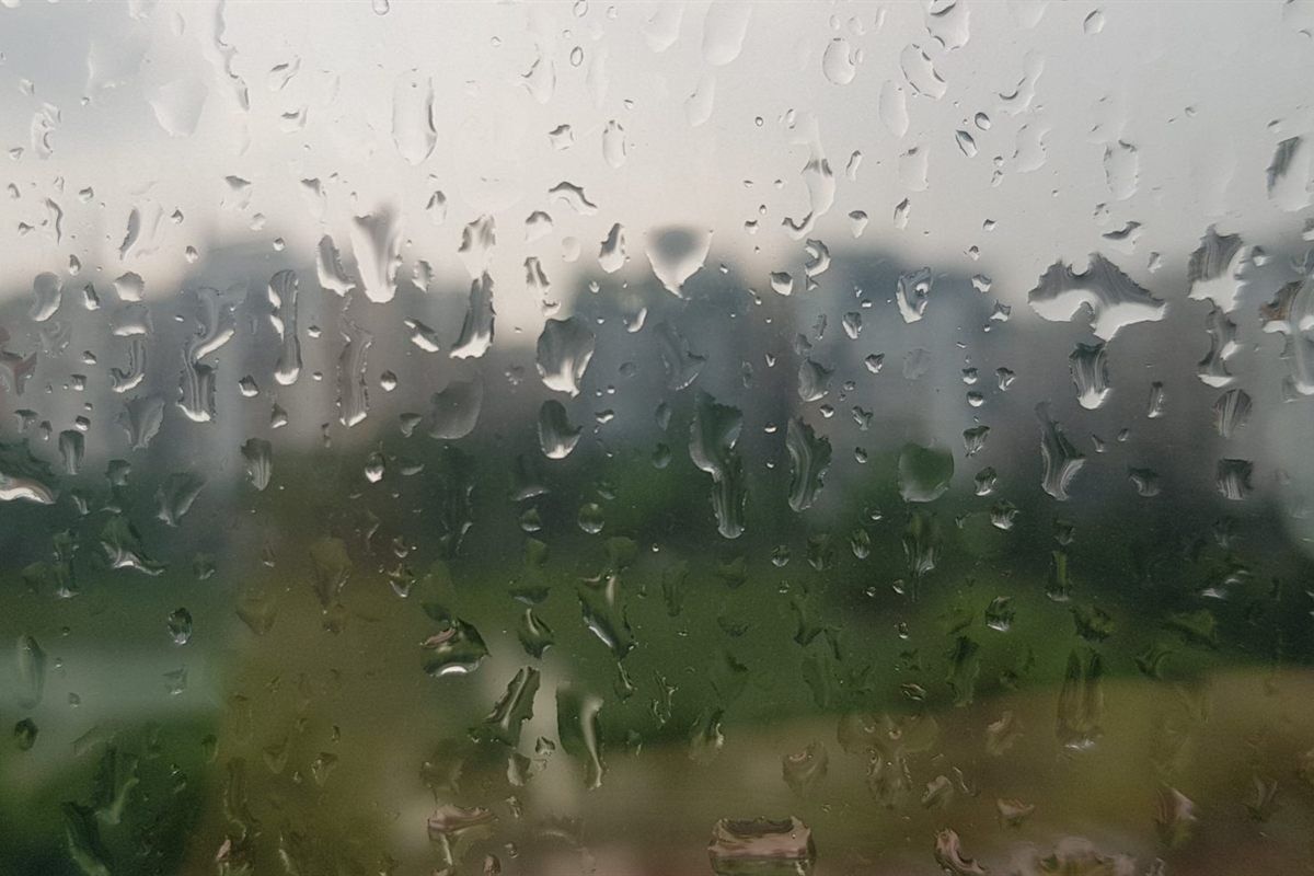 Rain running down a window pane