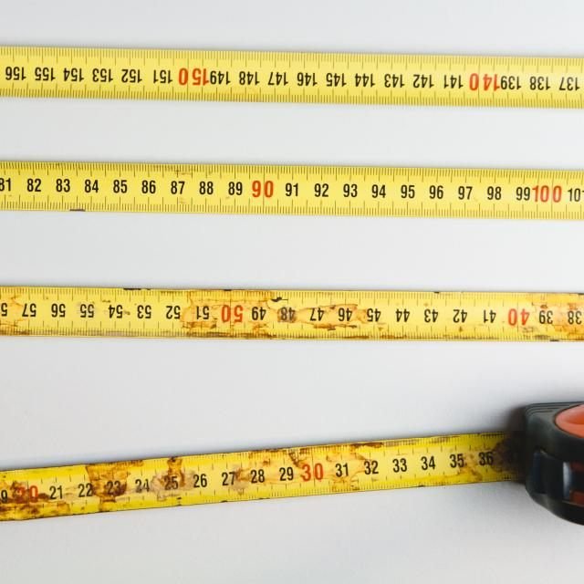 Retractable tape measures laid out together